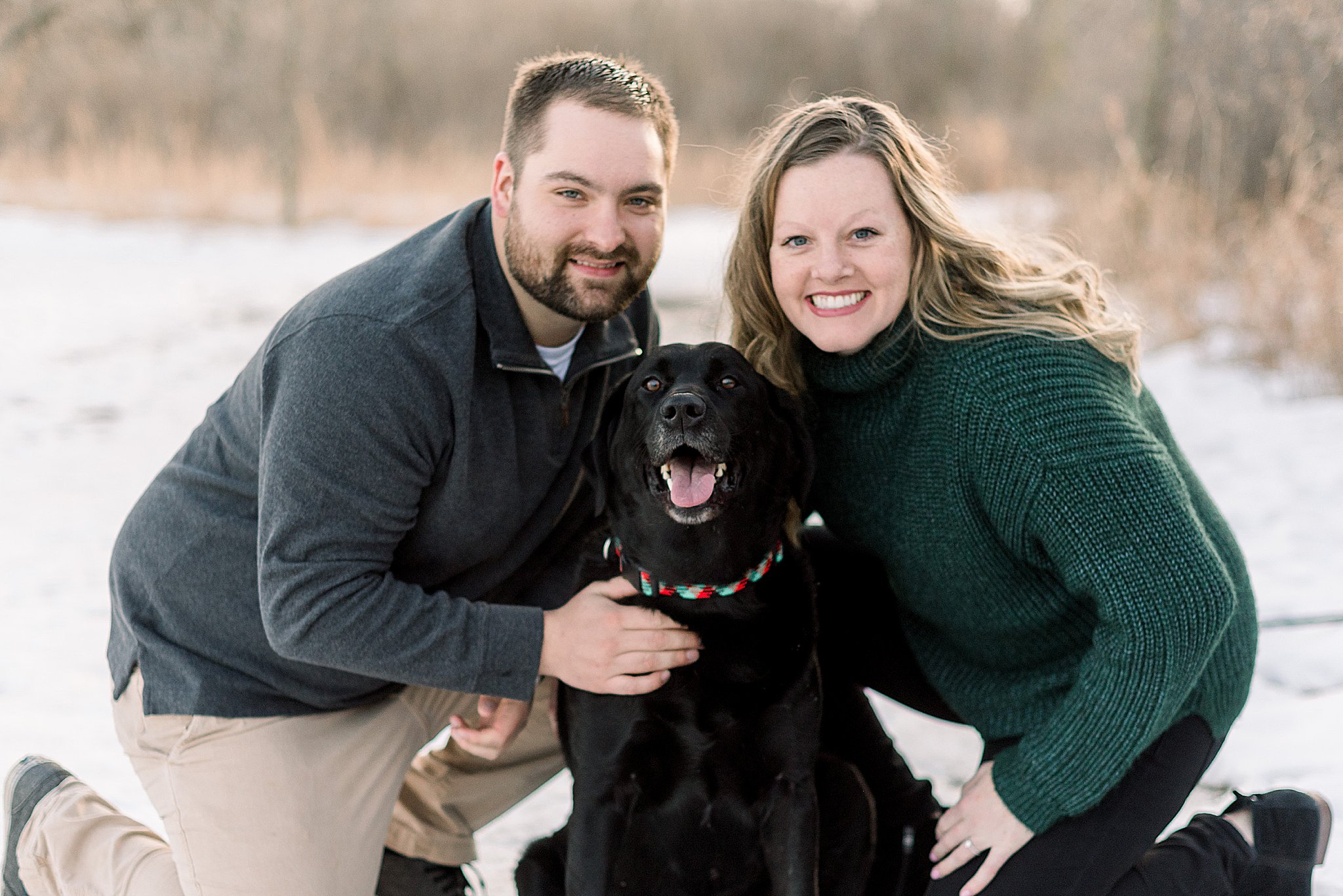 couple with dog during engagement session sioux falls south dakota engagement session in sertoma park