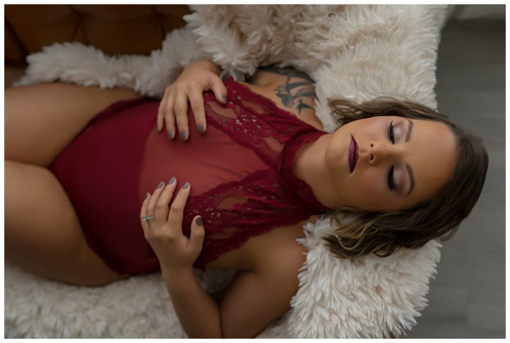 Woman laying with eyes closed for The Emma Christine Boudoir Experience