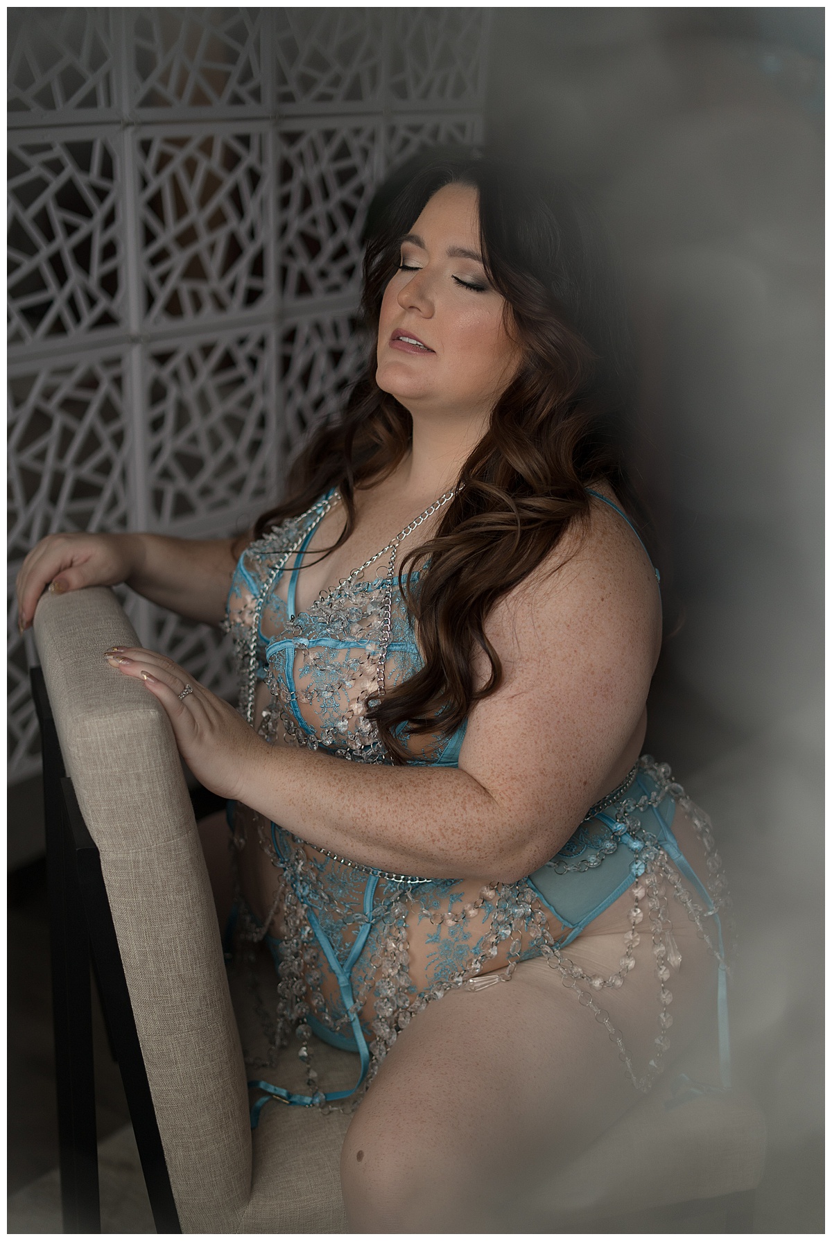 Female sits on chair in Lingerie Accessories