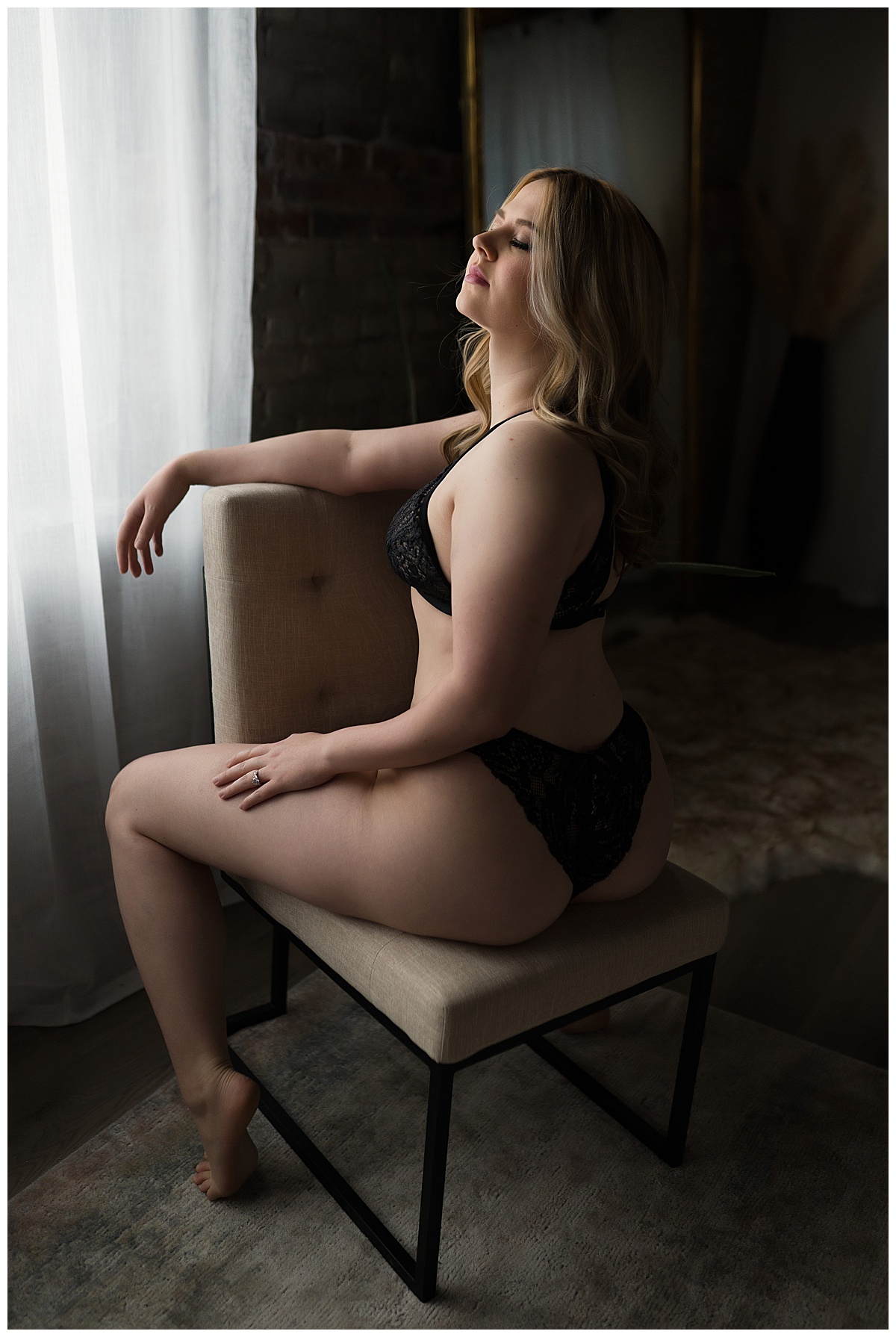 Adult sitting on chair for Sioux Falls Boudoir Photographer