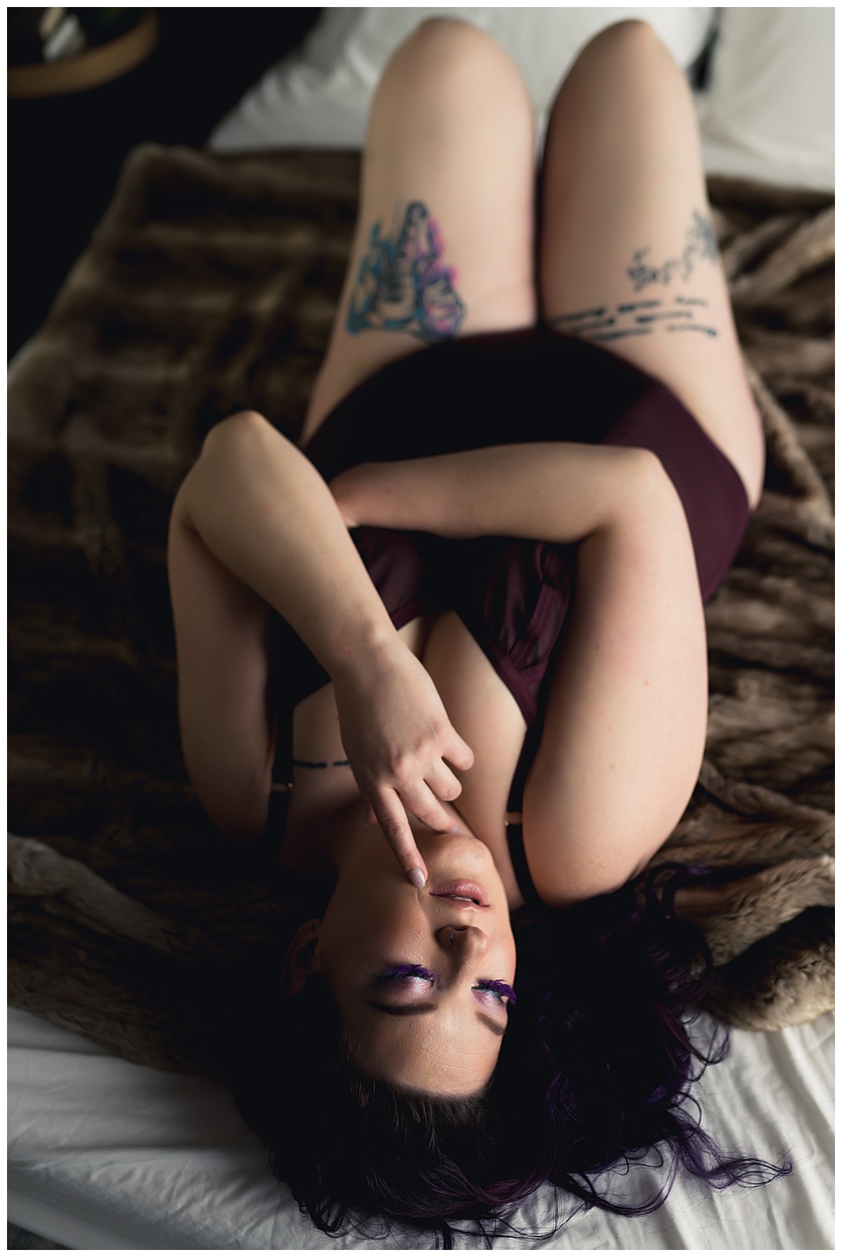 Person lays on fur blanket in lingerie Emma Christine Photography