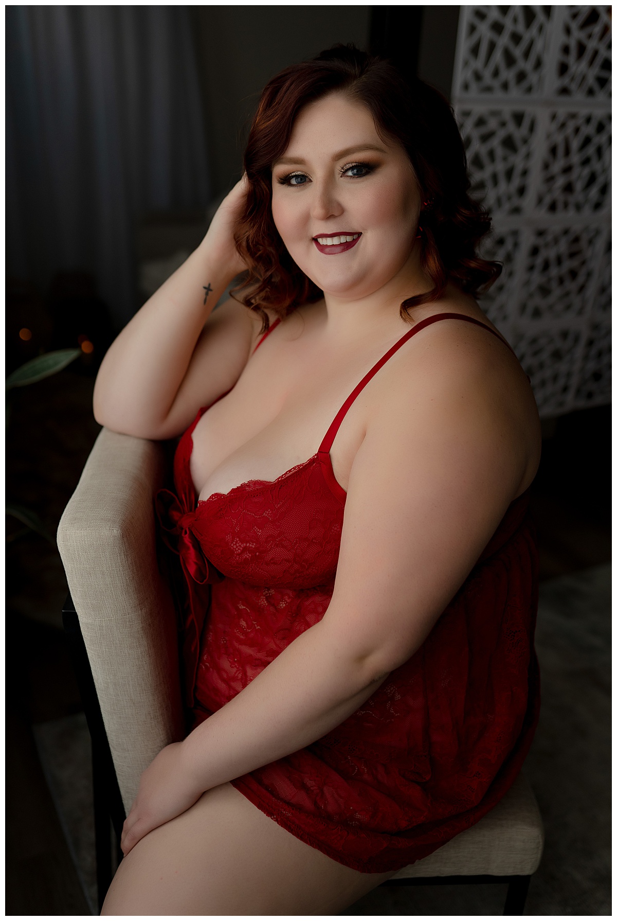 Female holds hand to hair for. Sioux Falls Boudoir Photographer
