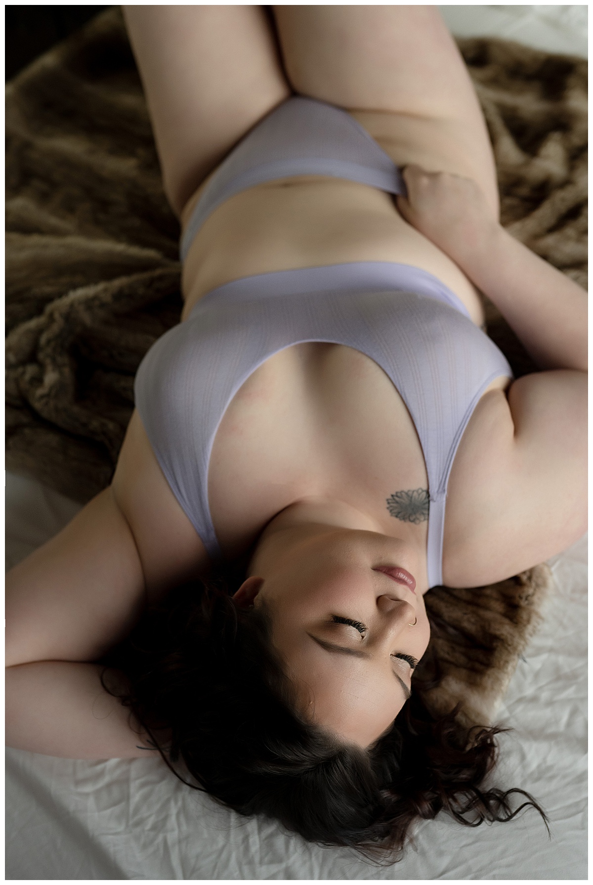 Female pulls on bottoms of lingerie for Emma Christine Photography