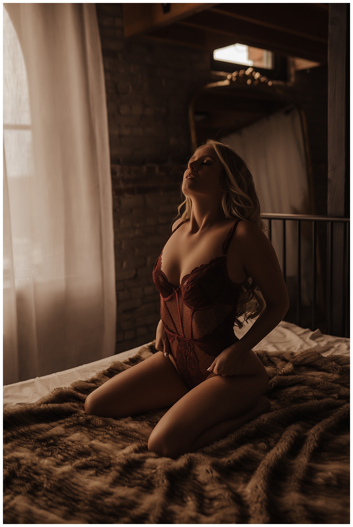 Adult kneels on bed for Sioux Falls Boudoir Photographer