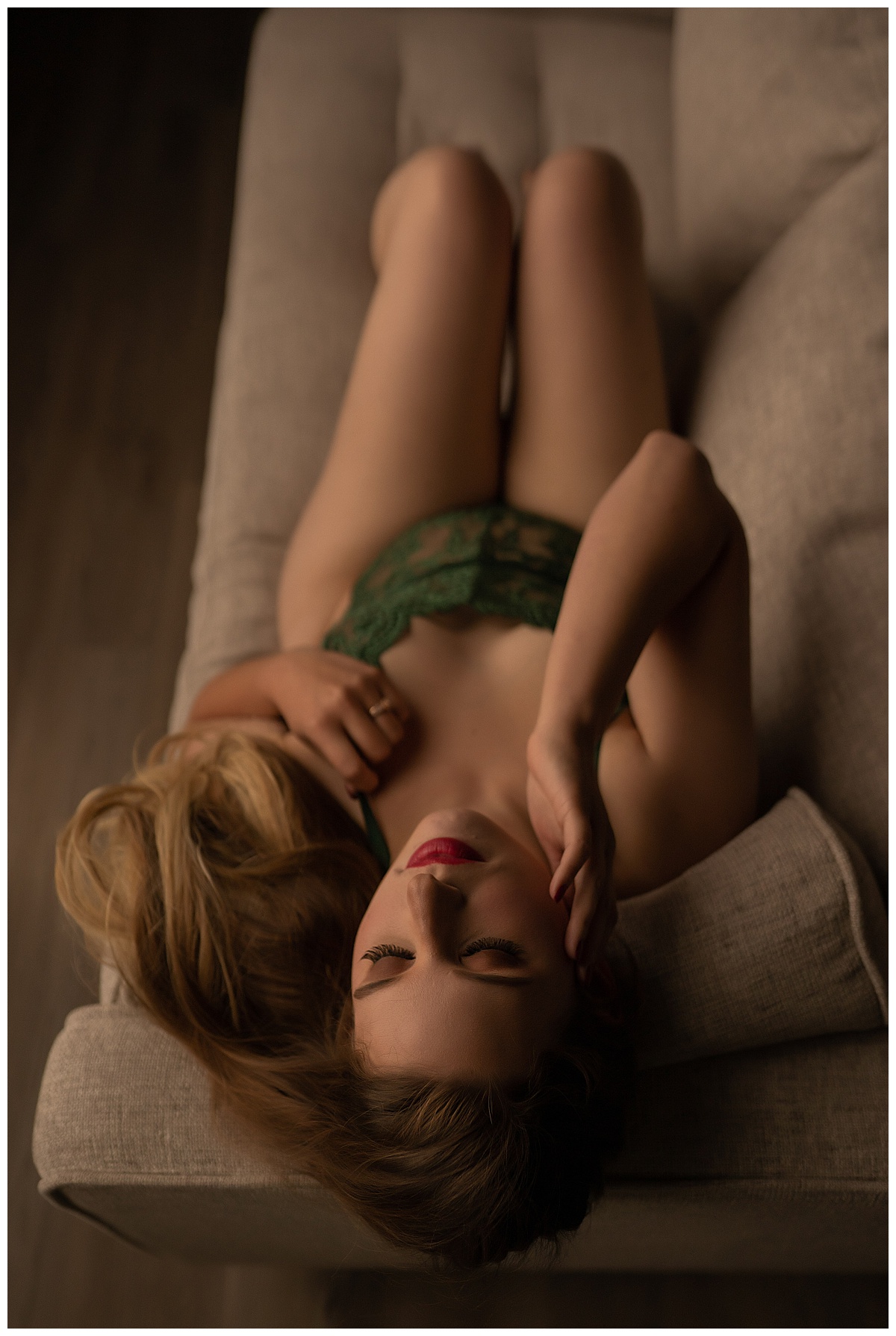 Lady lays on the edge of couch for Emma Christine Photography