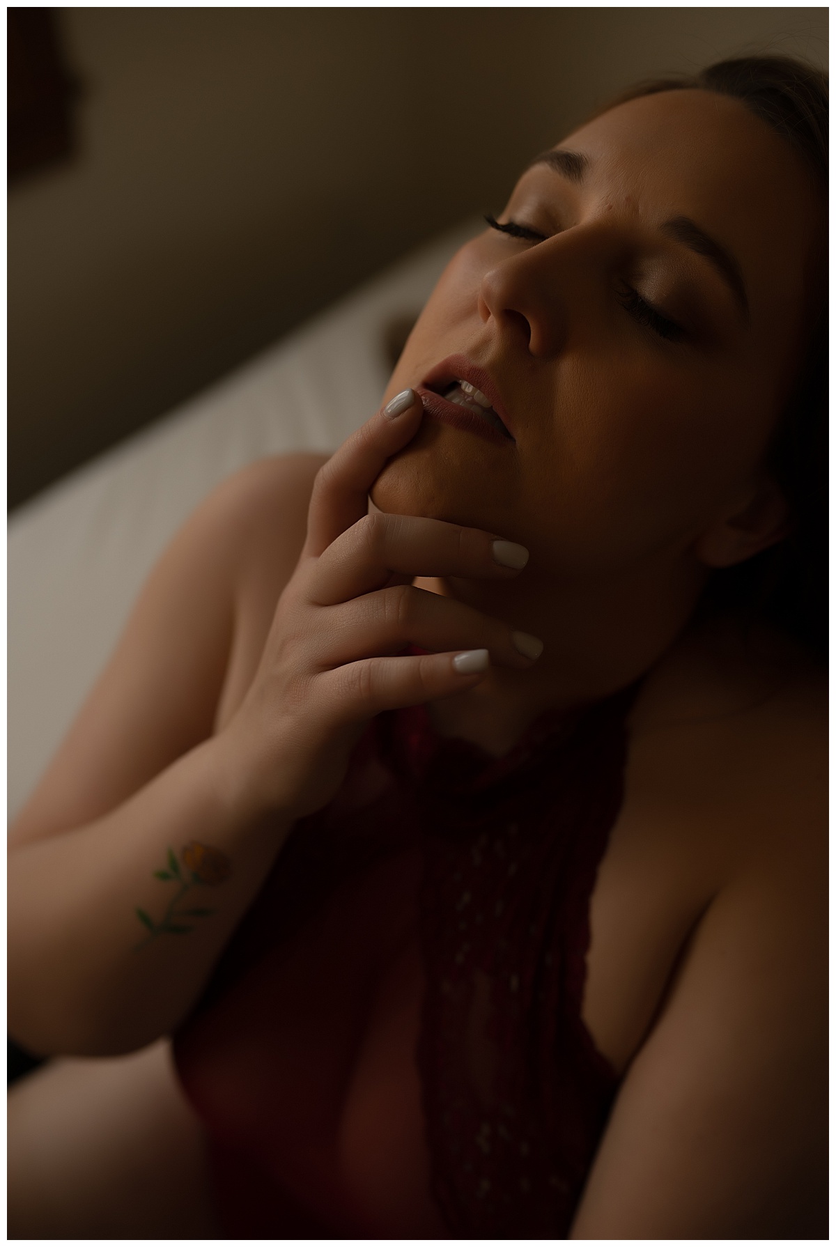Woman puts finger to mouth for Emma Christine Photography