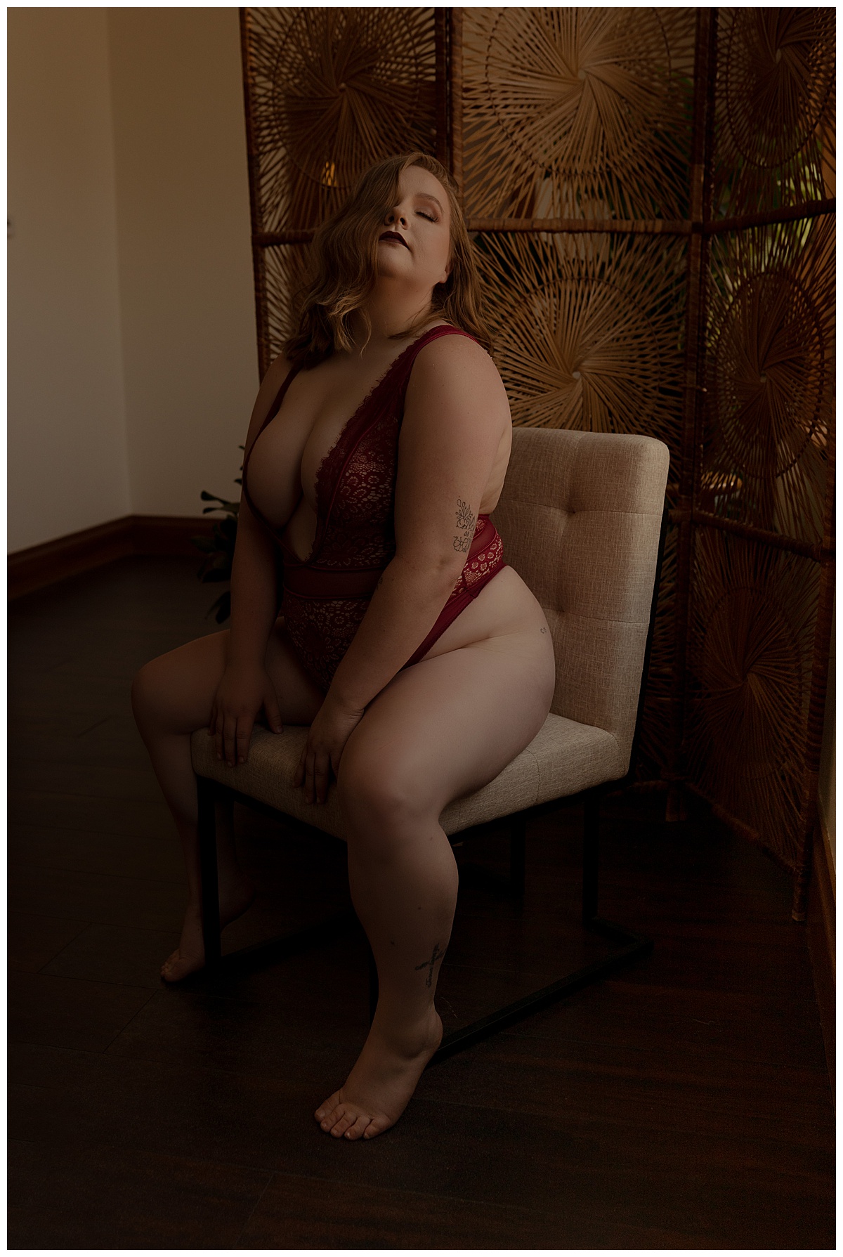 Female sits on the chair for Emma Christine Photography