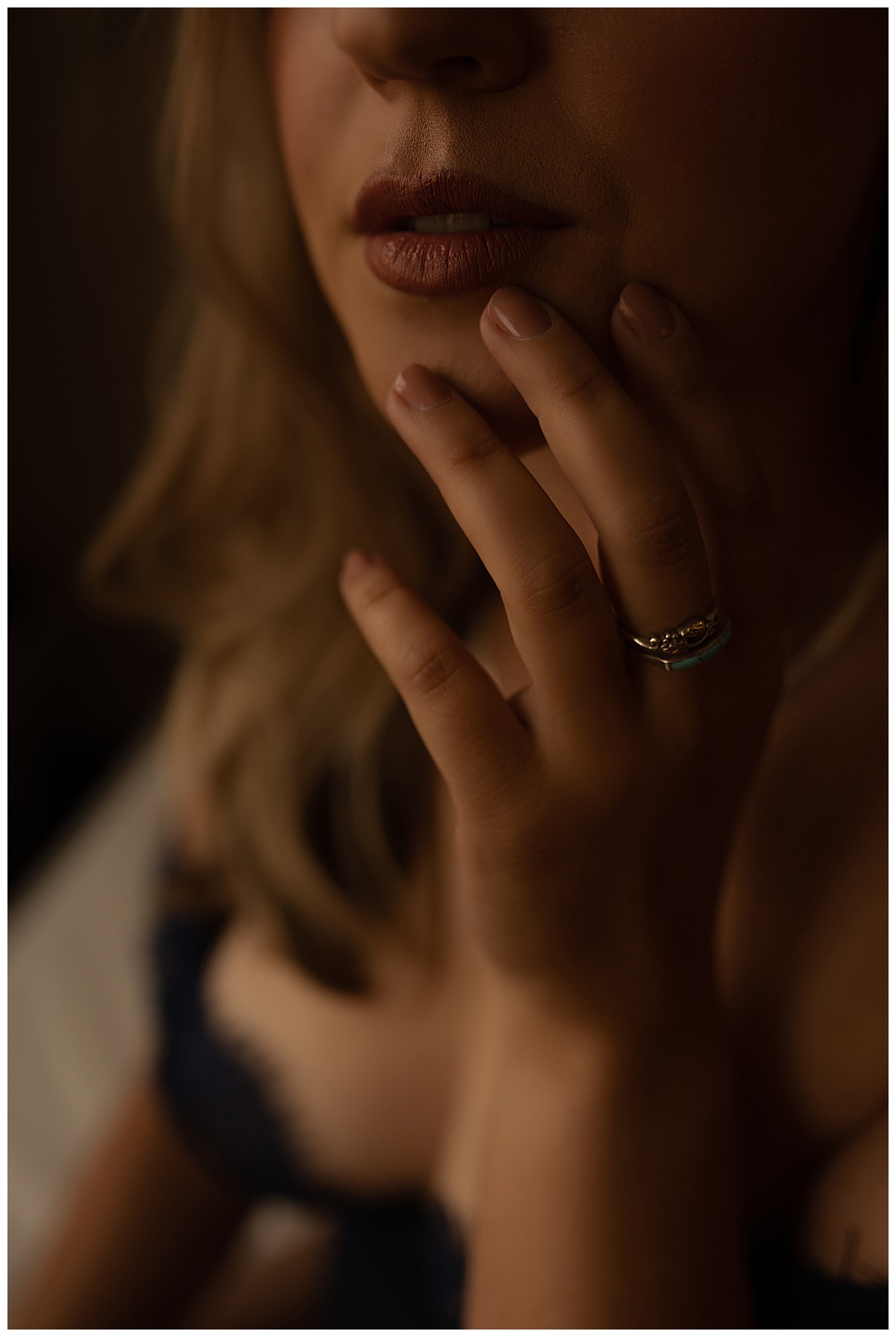 Lady holds fingers to mouth for Sioux Falls Boudoir Photographer