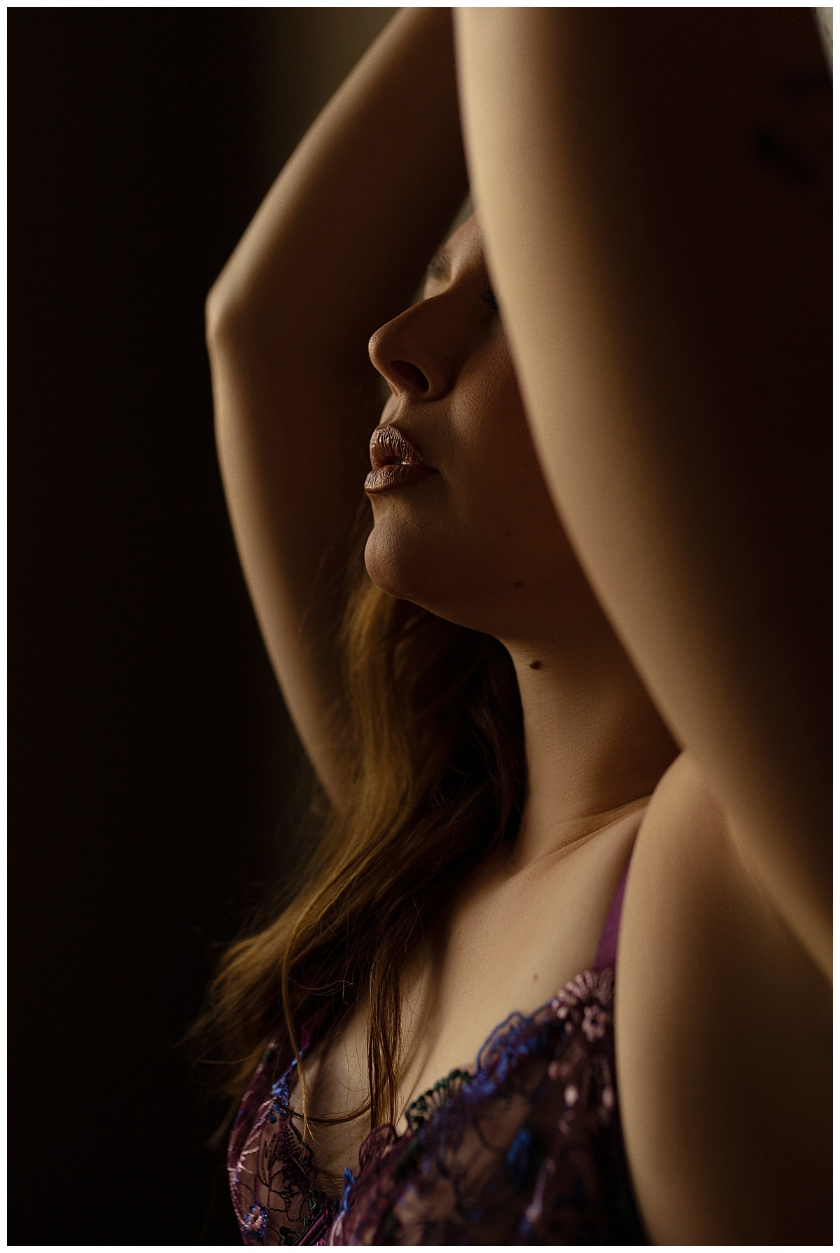 Girl holds hands above her head for  Sioux Falls Boudoir Photographer