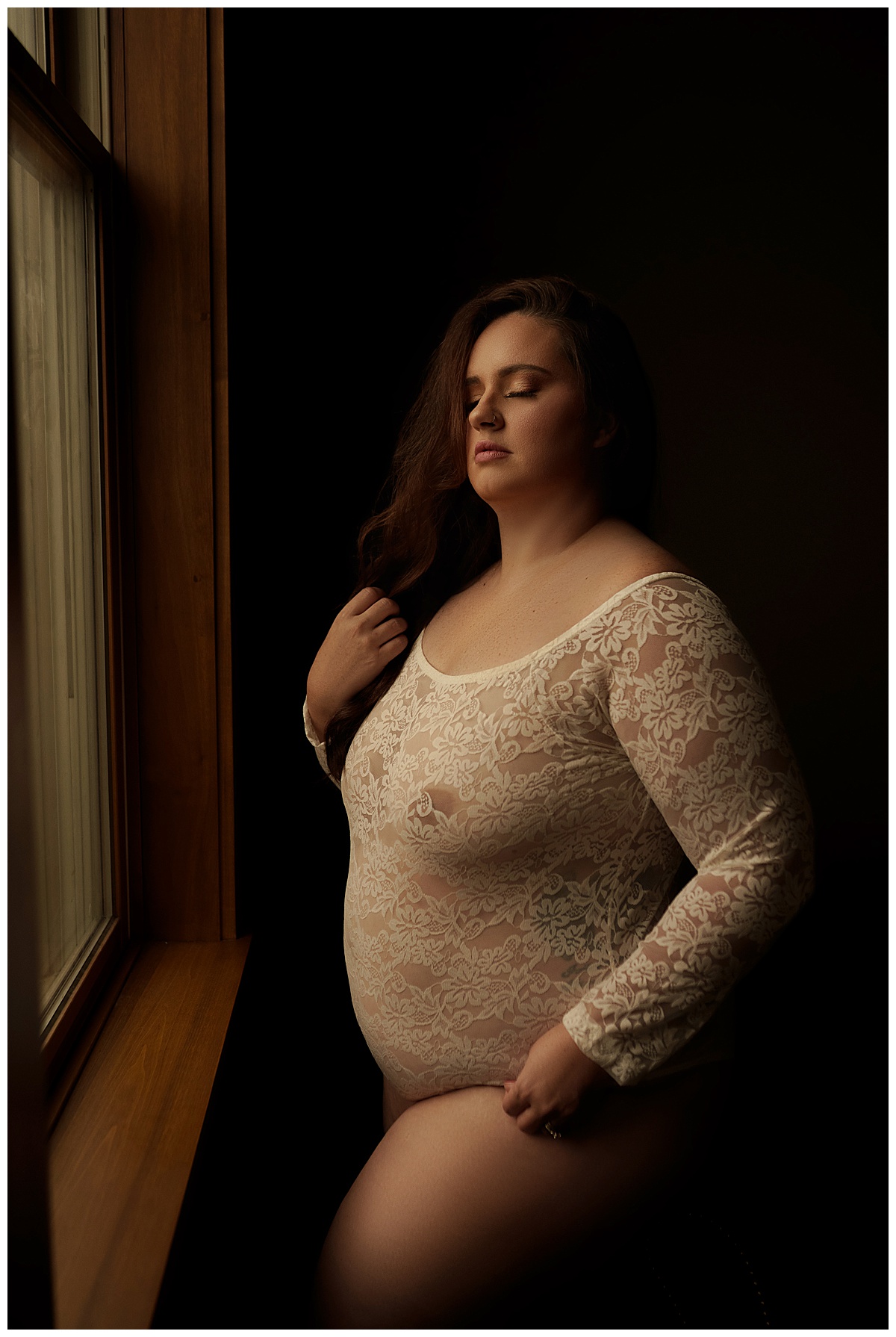 Person stands in front of a mirror for Sioux Falls Boudoir Photographer