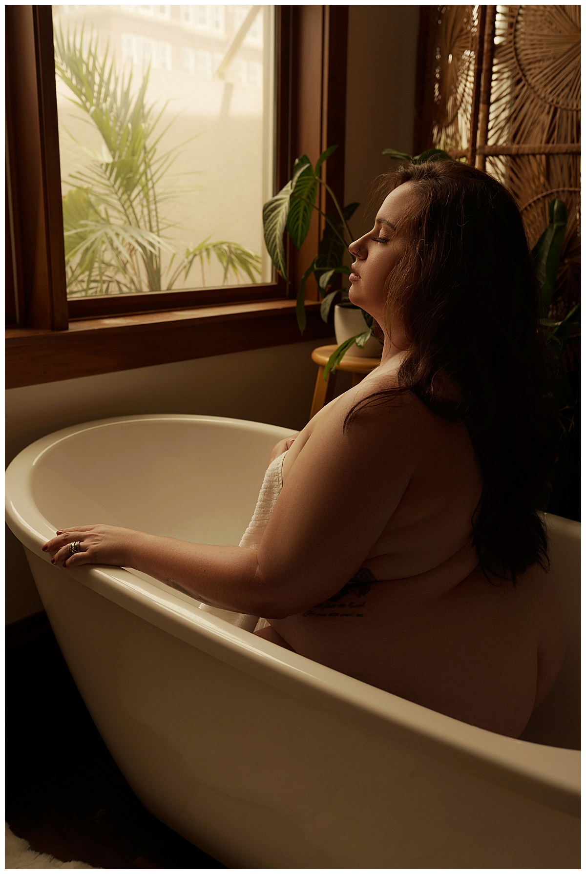 Female sits in the tub for Emma Christine Photography