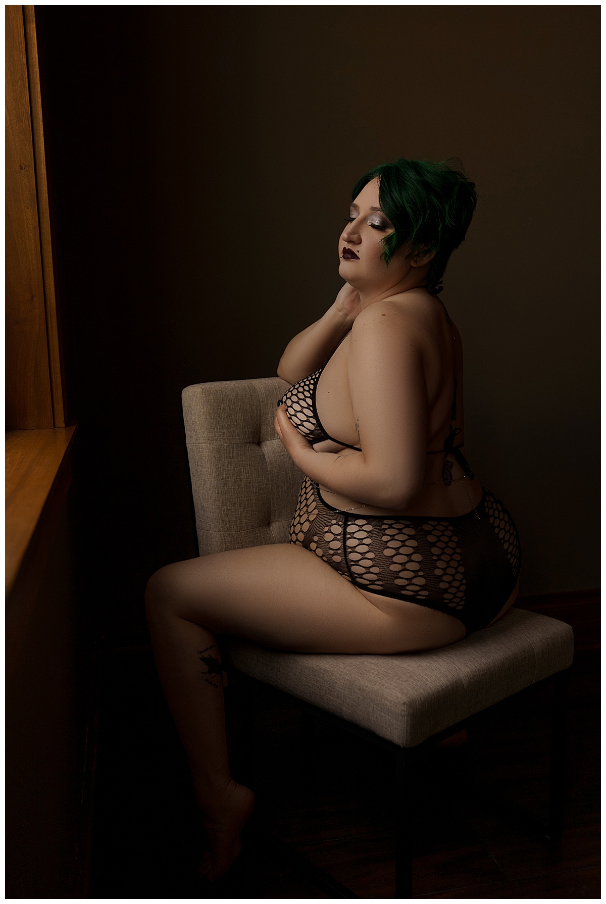 Adult coves chest with hand wearing black lingerie for Emma Christine Photography