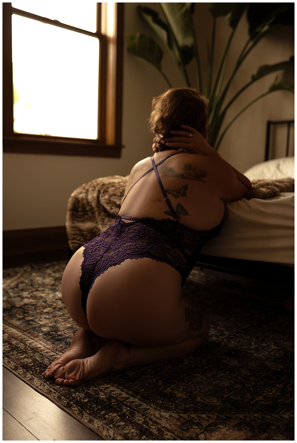 Stunning details on purple lingerie worn by a woman for Sioux Falls Boudoir Photographer