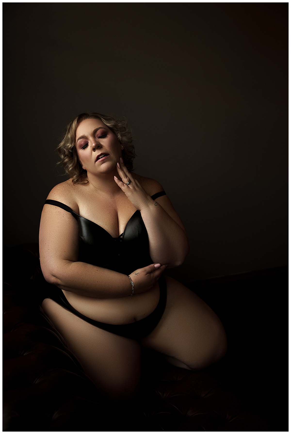 Woman wears black inclusive lingerie from Torrid