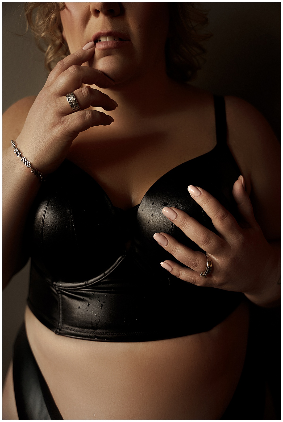 Woman wears black inclusive lingerie from Torrid