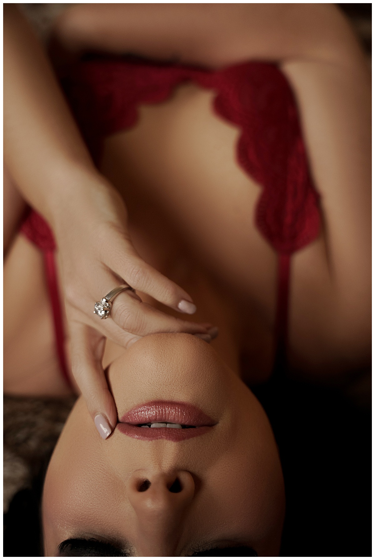 Woman wears red lingerie for Sioux Falls Boudoir Photographer