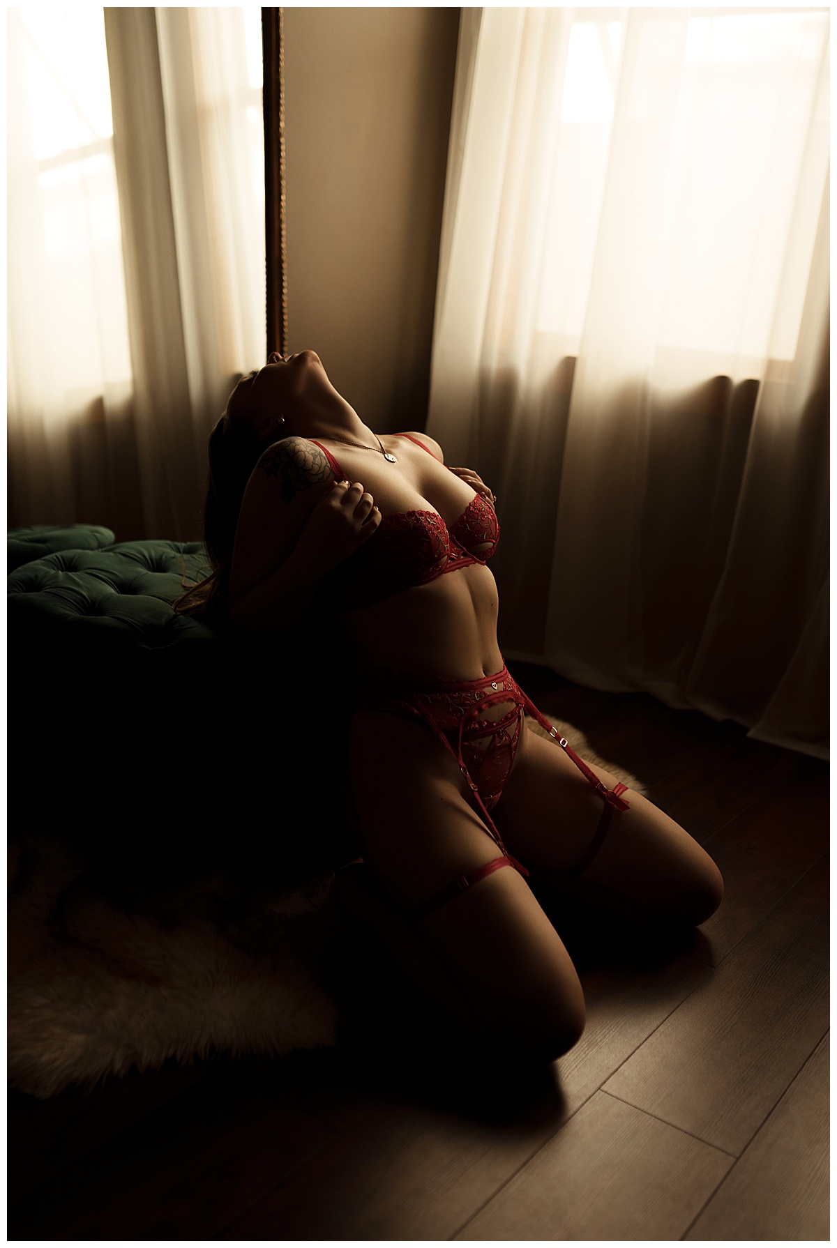 Female wears red lingerie for Sioux Falls Boudoir Photographer