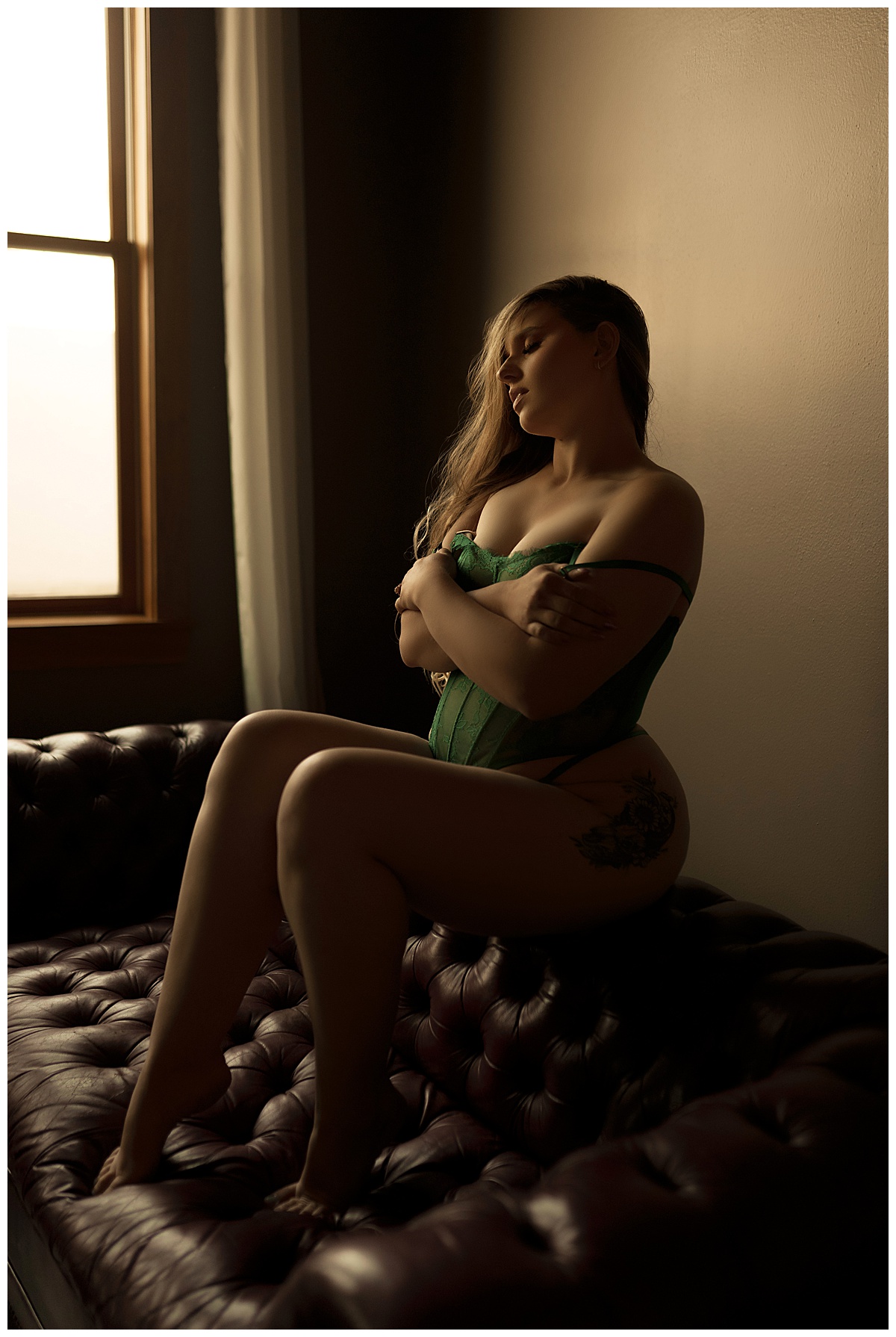 Adults covers her body wearing green lingerie for Emma Christine Photography