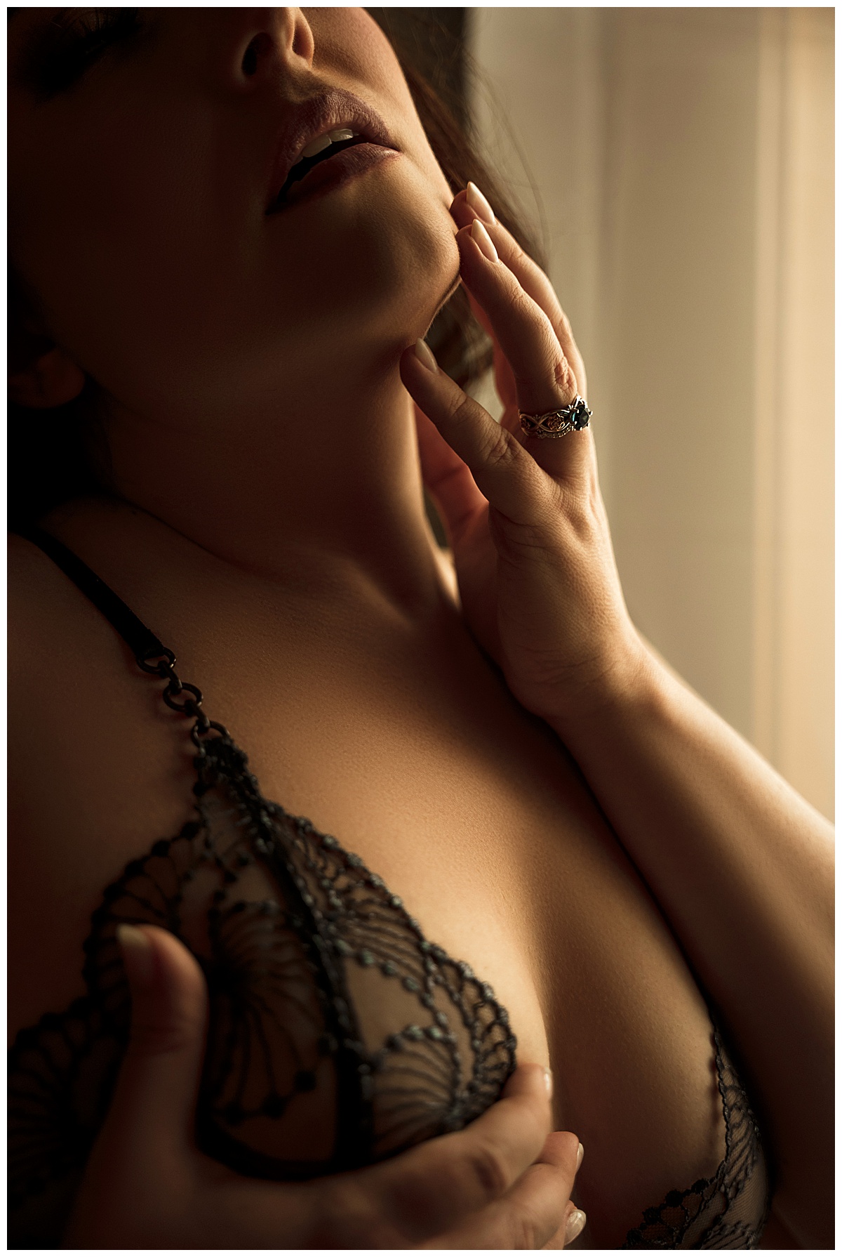 Adult holds her hand to her mouth showing Why You Shouldn’t Wait to book a boudoir session