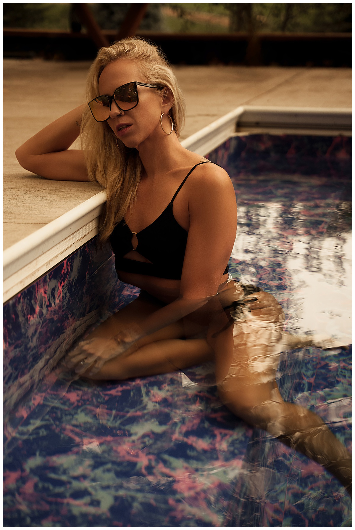 Person sits in the pool for Sioux Falls Boudoir Photographer