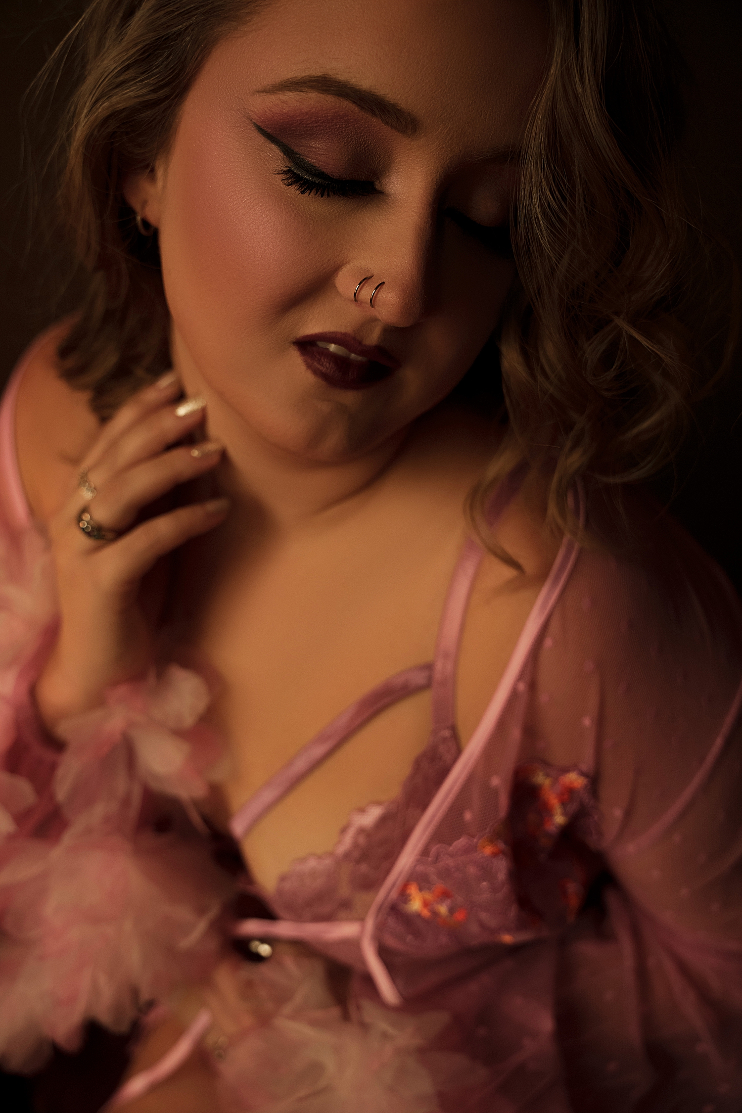 return client with double nose piercing in studio