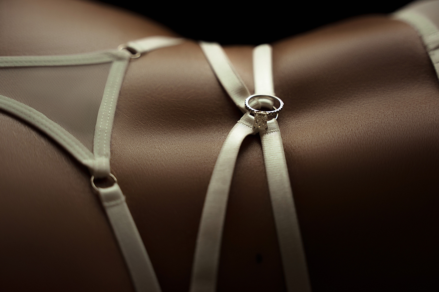 diamond ring on back of bride in lingerie by Emma Christine Photography