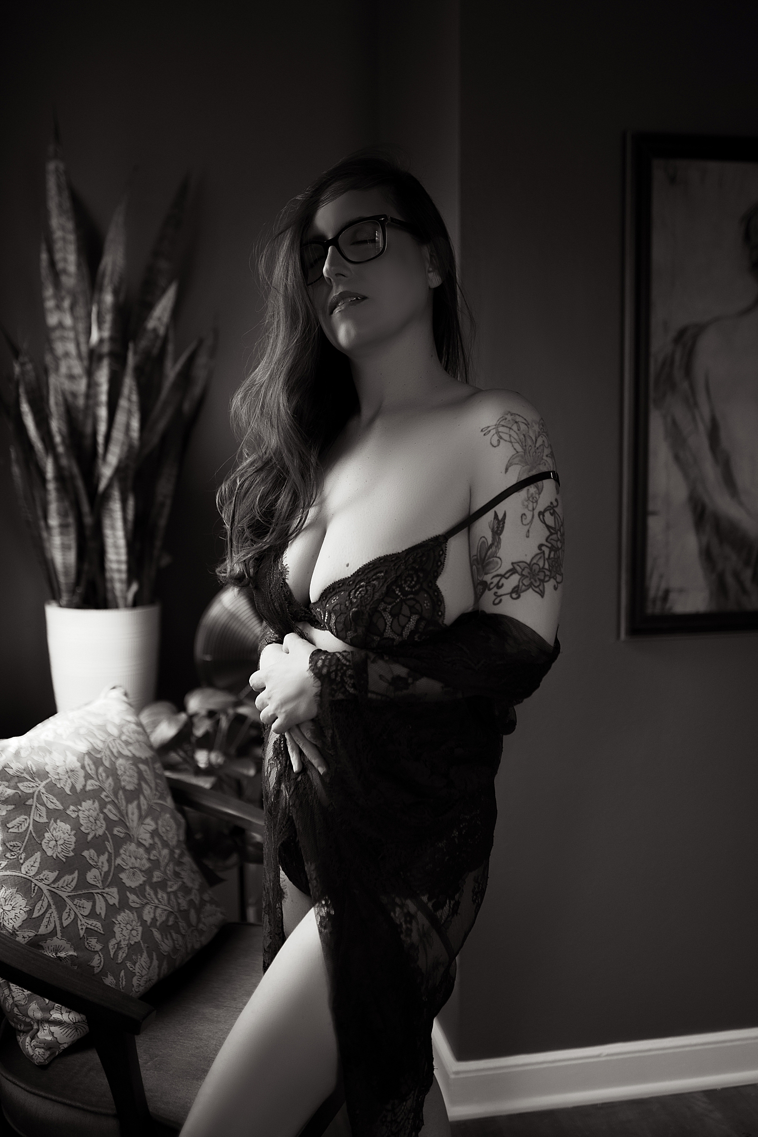 woman with long hair in lace bodysuit in photography studio shows you don't need a milestone to book a session