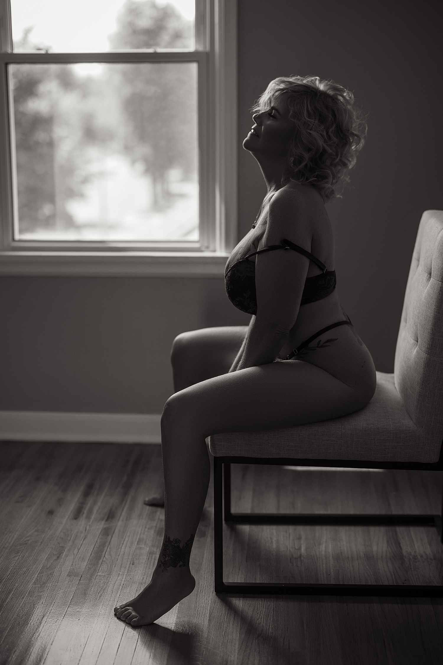 model sits on chair in studio showing off colorful lingerie inspiration